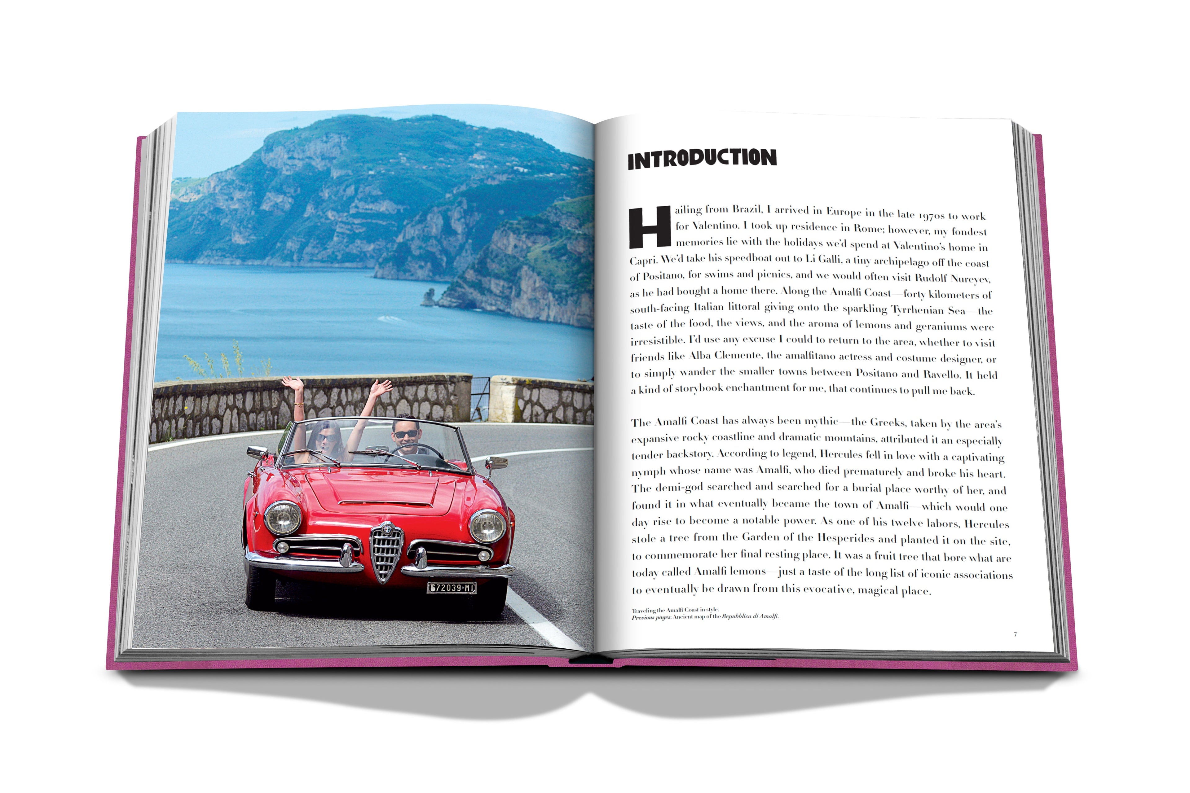 Open the "Amalfi Coast" by Assouline to see a photo of a red convertible cruising along the scenic côte Amalfitaine, framed by majestic mountains. The right page features text under the heading "Introduction.